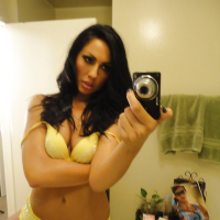 Brunette slut Tiffany Brookes taking mirror self shots while undressing