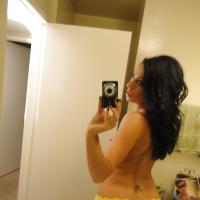Brunette slut Tiffany Brookes taking mirror self shots while undressing