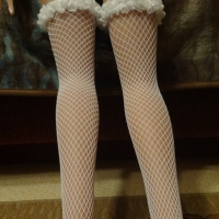 Doll in white lingerie and stockings