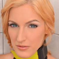 Mesh stocking attired blonde BDSM fetish model Mira Sunset pissing in bath