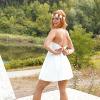 Sexy redhead babe Chrissy Fox strips naked and shows her shaved twat
