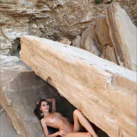 Spicy chick Leona Mia exposes a slim body outdoors