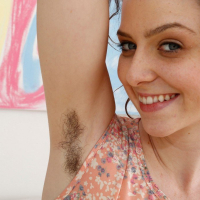 Babe Emma Evins spreads and fingers her hairy Hole