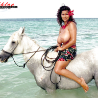 European solo model Chloe Vevrier demonstrating hooters in ocean and on beach