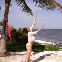 French solo girl Chloe Vevrier demonstrating massive knockers on beach