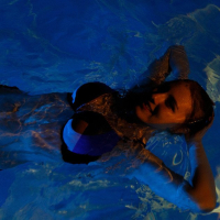 Melody Marks takes off her wet bikini in the pool