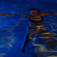 Melody Marks takes off her wet bikini in the pool