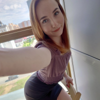 A petite pale redhead shows her nice tits