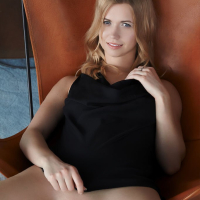 Violette Pure on a Chair spreading her long Legs