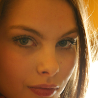 Brunette Lili posing in a kitchen