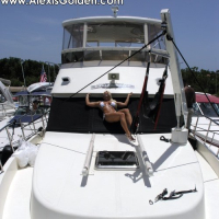 Busty Alexis Golden stripping on her Boat