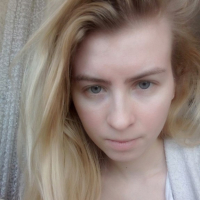 Blue eyed beauty shows off her tiny tits