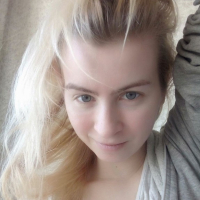 Blue eyed beauty shows off her tiny tits