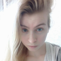 Blue eyed beauty shows off her tiny tits