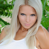 Stunning blonde bombshell Katerina H undresses and reveals her twat