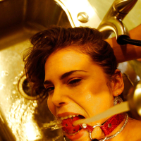 Young babe Izy Bella Blu gets bondage fucked with a gag in her mouth