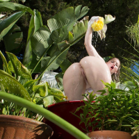 Sunny Lane washes her nude Body in the Garden