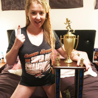 Naughty Girl Sunny Lane posing with her Trophy