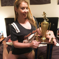 Naughty Girl Sunny Lane posing with her Trophy