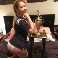 Naughty Girl Sunny Lane posing with her Trophy