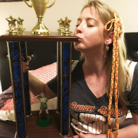 Naughty Girl Sunny Lane posing with her Trophy