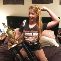 Naughty Girl Sunny Lane posing with her Trophy