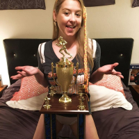 Naughty Girl Sunny Lane posing with her Trophy