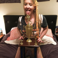 Naughty Girl Sunny Lane posing with her Trophy