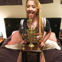 Naughty Girl Sunny Lane posing with her Trophy