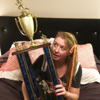 Naughty Girl Sunny Lane posing with her Trophy