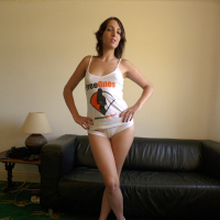 Liz Rainbow posing and stripping her FreeOnes Gear