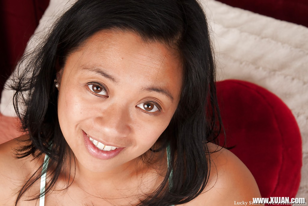 Horny asian MILF Lucky Starr stripping and posing naked on the bed - Photo #576082