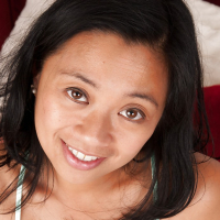 Horny asian MILF Lucky Starr stripping and posing naked on the bed