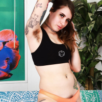 Kinky tattooed chick Pearl Sage revealing her massive hairy snatch