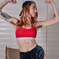 Pink haired babe Pearl Sage spreads her hairy legs