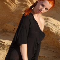 Ariel Piper Fawn swings red hair around while stripping for nude glam shoot