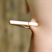 Skinny redhead BDSM model Susana Melo has clothespin attached to tits