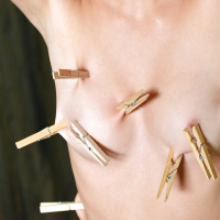 Skinny redhead BDSM model Susana Melo has clothespin attached to tits