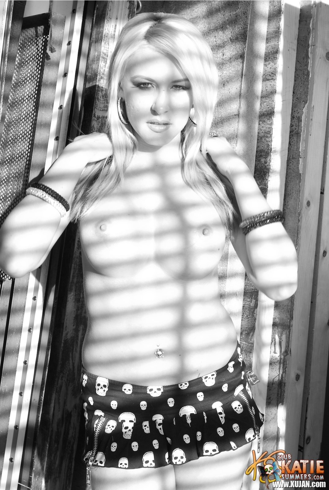Blonde hottie Katie Summers flashing her tits behind the window - Photo #595162