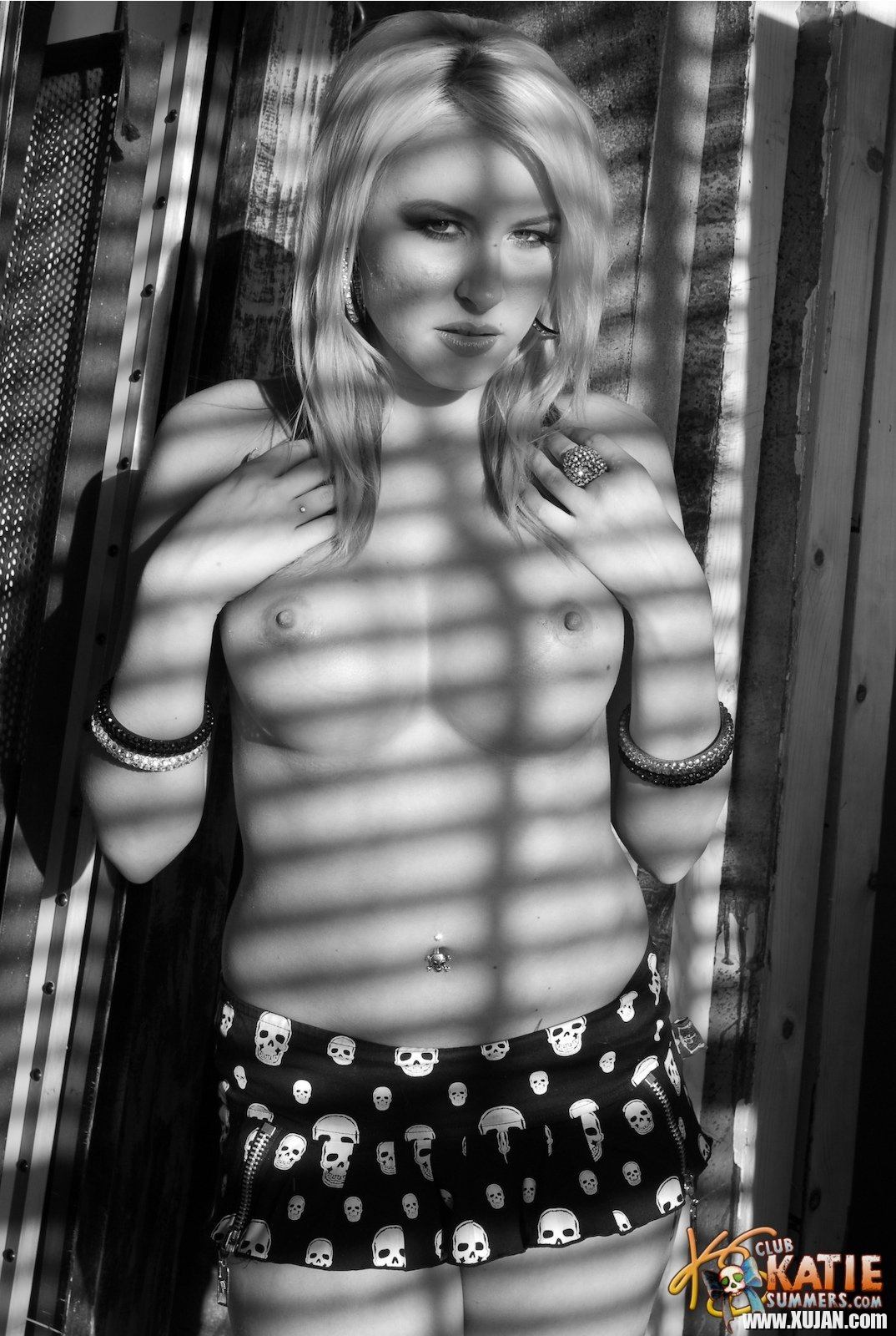 Blonde hottie Katie Summers flashing her tits behind the window - Photo #595163