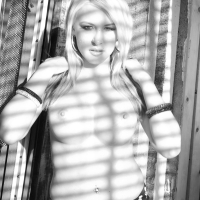Blonde hottie Katie Summers flashing her tits behind the window