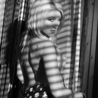 Blonde hottie Katie Summers flashing her tits behind the window
