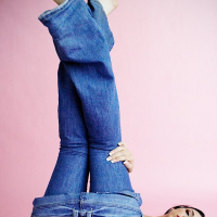 Stunning dark haired babe Tiffany Tyler strips off her tight blue jeans