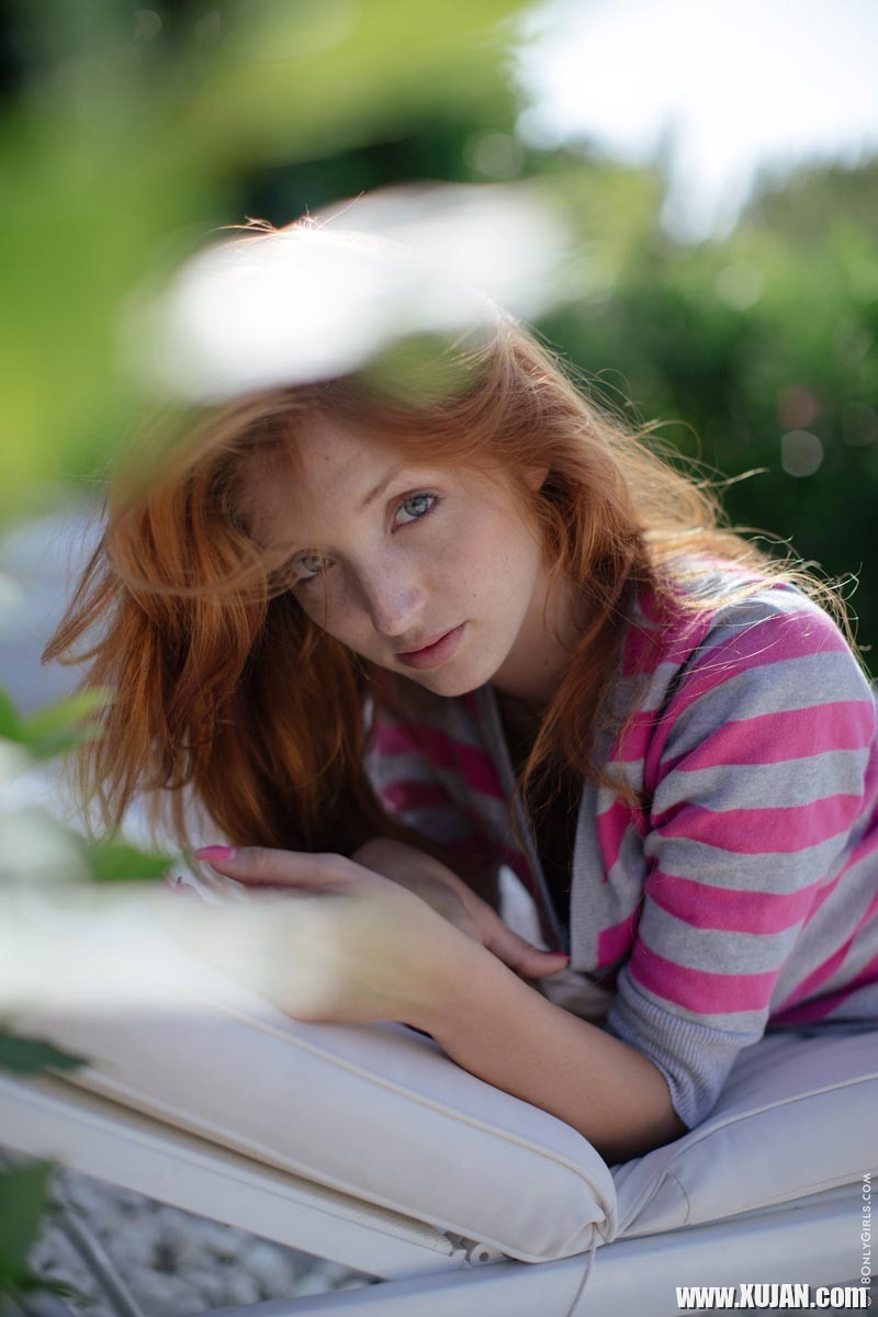 Horny teen redhead Red Fox strips on a lounge chair - Photo #604026