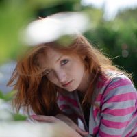 Horny teen redhead Red Fox strips on a lounge chair