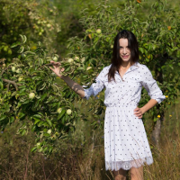 Skinny Adel Morel poses naked in an apple garden