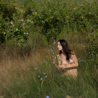 Skinny Adel Morel poses naked in an apple garden