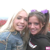 Hardcore teen lesbians screwing with a large strapon dildo