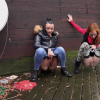 Daphne Klyde and Sandra take a leak together