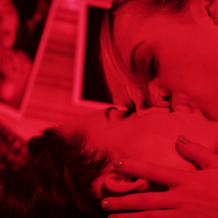 Kinky bitches Sabina Rouge and Lilly Bell making sex in the darkroom